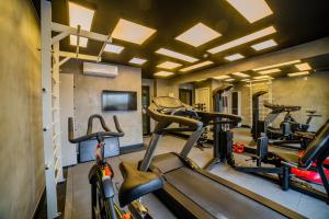 a gym with treadmills and bikes in a room at Charlie Dstay Moema in Sao Paulo