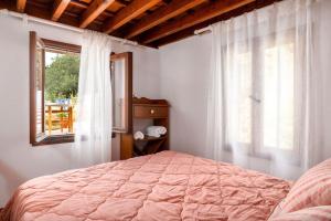 Posteľ alebo postele v izbe v ubytovaní Acropolis Lindos House + 13 fotografií