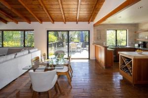a kitchen and living room with a table and chairs at Solana Beach House! Minutes to Dog Beach & Cedros in Solana Beach