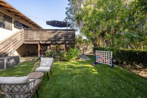 a backyard with a ping pong table and chairs at Solana Beach House! Minutes to Dog Beach & Cedros in Solana Beach