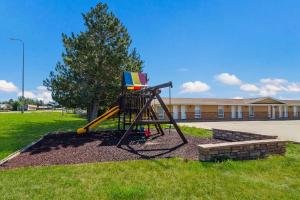 a playground with a slide in a park at Best Western Graham's in Murdo