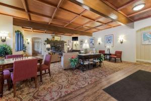 a living room with a table and chairs at Best Western Tyrolean Lodge in Ketchum
