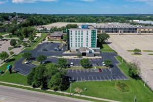 an aerial view of a building with a parking lot at Clarion Suites at the Alliant Energy Center in Madison