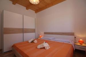 a bedroom with two beds with towels on them at Mirjana in Kmeti (Haus für 4-5 Personen) in Žminj