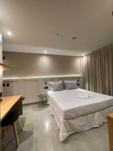 Postel nebo postele na pokoji v ubytování Concept Studios Barrinha + 61 fotografií