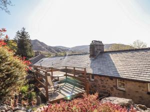 an external view of a house with a wooden deck at Bridgeway House in Blaenau-Ffestiniog