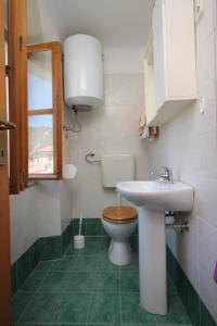 a bathroom with a toilet and a sink at Apartments with WiFi Beli, Cres - 8094 in Beli