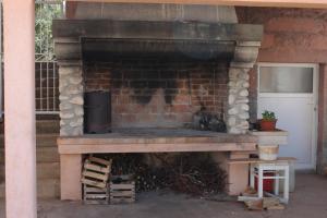 a brick fireplace with a cat sitting in it at Apartment Bozava 8100a in Božava