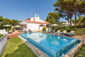 a swimming pool in the backyard of a house at Villa Pinar by Villa Plus in Ferreries