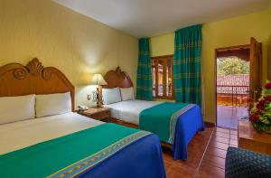 Postel nebo postele na pokoji v ubytování Hotel la Parroquia + 37 fotografií