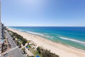 an aerial view of a beach and the ocean at Meriton Suites Surfers Paradise in Gold Coast