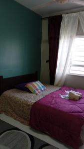 En eller flere senge i et værelse på D'Kayangan KTcity Seaview Homestay