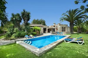 a swimming pool in the yard of a house at Villa Tia by Villa Plus in Pollença