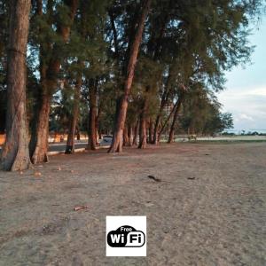 a group of trees in a park with a logo at D'Kayangan KTcity Seaview Homestay in Kuala Terengganu