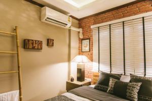 Postel nebo postele na pokoji v ubytování Ruanmata Homestay