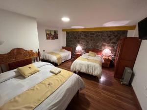 Postel nebo postele na pokoji v ubytování Hotel Choquequirao