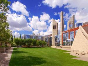 a campus with a green lawn in front of a building at Steamy Romantic Greek Corneer Suite King U/G Wifi in Edmonton