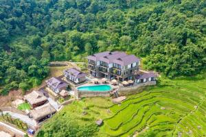 an aerial view of a large house with a pool at Central hills Puluong resort in Hương Bá Thước