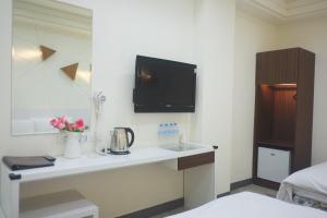 TV a/nebo společenská místnost v ubytování 柜富賓王旅店-台北館 Giant Rich King Plaza Hotel
