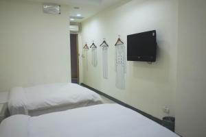 TV a/nebo společenská místnost v ubytování 柜富賓王旅店-台北館 Giant Rich King Plaza Hotel