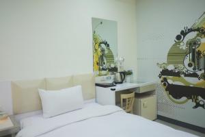 Postel nebo postele na pokoji v ubytování 柜富賓王旅店-台北館 Giant Rich King Plaza Hotel