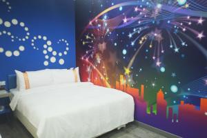Postel nebo postele na pokoji v ubytování 柜富賓王旅店-台北館 Giant Rich King Plaza Hotel