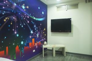 TV a/nebo společenská místnost v ubytování 柜富賓王旅店-台北館 Giant Rich King Plaza Hotel