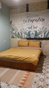 Postel nebo postele na pokoji v ubytování Dulan Tranquilo Hostel 台東都蘭晃輕鬆背包客棧
