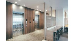 a conference room with a long table and chairs at Kuretake Inn Premium Shizuoka Annex in Shizuoka