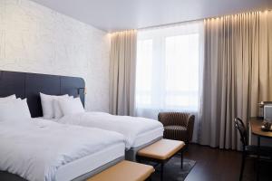 Postel nebo postele na pokoji v ubytování Solo Sokos Hotel Helsinki