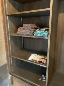 a closet with some folded shirts in it at Shozu no Yado Hamakaze - Vacation STAY 37514v in Ōbe