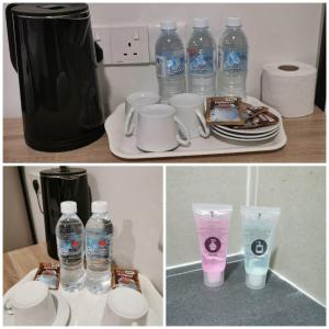 话毛生Hotel Mutiara的一组瓶装水和杯子在柜台上