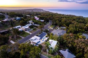 an aerial view of a town with the ocean at KiteSurf 1770 Beach House in Agnes Water