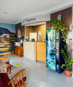 a store with an aquarium in a vending machine at Hostal L'Anfora in Denia