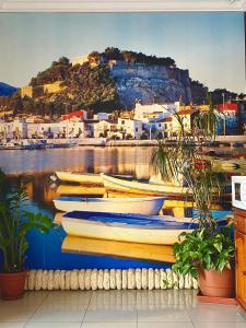 a group of boats docked in a harbor at Hostal L'Anfora in Denia