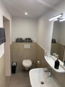 Koupelna v ubytování Smart Stay Rooms Feldkirch + 27 fotografií