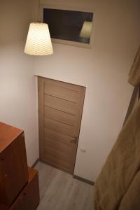 a room with a closet and a door and a light at SLEEP STUDIO Hostel in Yerevan