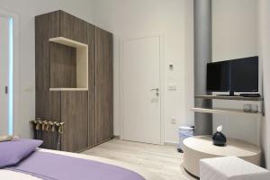 Televízia a/alebo spoločenská miestnosť v ubytovaní Apartments & Rooms Lavandula Exclusive
