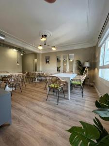 a large room with chairs and a table and a table and chairs at VTZ El Balcón de Conde de Aranda III in Zaragoza +17 photos