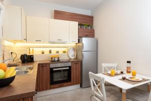 Kuchyň nebo kuchyňský kout v ubytování Cozy Corner - Central Stylish Apartment