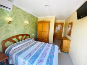Postel nebo postele na pokoji v ubytování Hostal L'Anfora