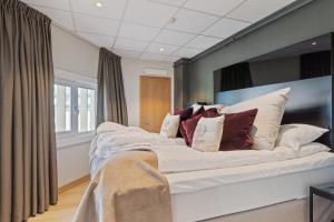 Postel nebo postele na pokoji v ubytování Quality Hotel Saga