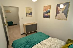 Posteľ alebo postele v izbe v ubytovaní Apartament Witold