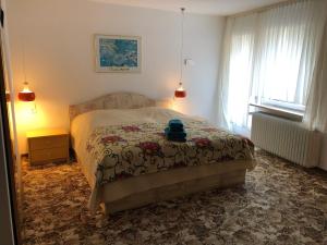 Ένα ή περισσότερα κρεβάτια σε δωμάτιο στο Ohana Bed and Breakfast