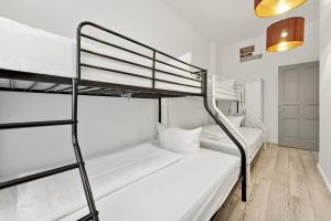 a bedroom with two bunk beds in a hostel at Sweet Central Tiny Apartment for 4 People in Berlin