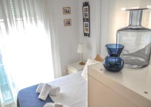Postel nebo postele na pokoji v ubytování Livemálaga Caballería