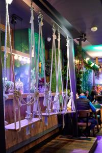 a swing in a restaurant with people in the background at Fama Residence Gdańsk Old Town in Gdańsk