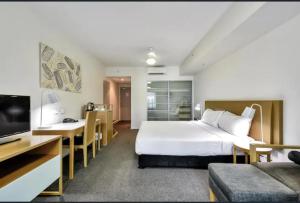 Uma cama ou camas num quarto em Pandanus