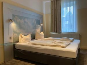 Postel nebo postele na pokoji v ubytování Landhotel Vosse-Schepers + 37 fotografií