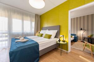Postel nebo postele na pokoji v ubytování Hotel Forrás Zalakaros